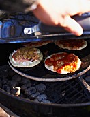 Mini pizzas on a barbecue