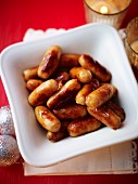 Mini sausages in a white bowl for Christmas