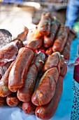 Home-made raw sausages at a market