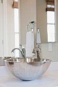 Close-up of stainless steel sink in bathroom; Irvine; California; USA