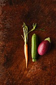 A carrot, a courgette and an aubergine