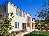 Exterior of two story house with lawn; San Marcos; California; USA