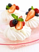 Mini meringues with cream and berries