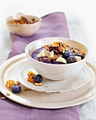Blueberry yoghurt with cereals and almonds