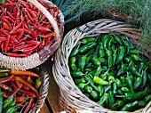 Various chilli peppers in baskets