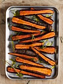 A tray of oven-ready organic purple carrots