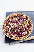 A red vegetable with beetroot and a crumble base