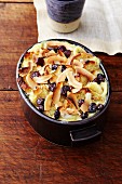 A sweet gratin made with baguette, banana and coconut chips