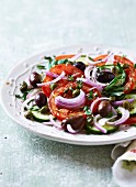 Tomato salad with capers, olives and cucumber (France)