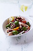 Tuna fish salad with beans, tomatoes and green olives