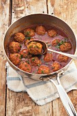 Sweet and sour meatballs in a pan