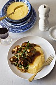Braised duck with a mushroom ragout and polenta