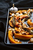 Roasted butternut squash wedges with feta, rosemary and harissa