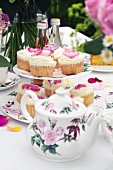 Rose petal cupcakes on a table laid for tea