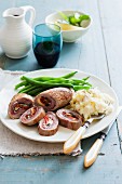 Veal roulade with mashed potatoes and beans