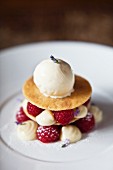 A layered dessert with shortcrust biscuits, raspberries, lavender and ice cream