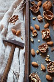 Cracked walnuts and almonds with a hammer