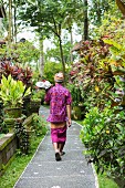 Balinese man walking along path
