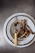 Chicken bones on a plate