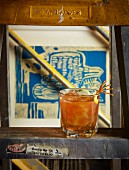 An Old Fashioned cocktail with orange zest