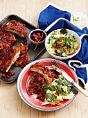 Tangy pork ribs with tomatoes and lettuce