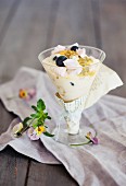 Vanilla cream with blueberries and passion fruit sauce