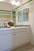 Bathroom with washbasin and large mirror; San Marcos; California; USA