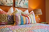 Throw pillows arranged on bed; Azusa; California; USA