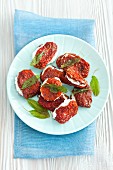 Dried tomatoes stuffed with feta and fried sage
