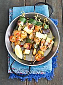 Salmon skewers with courgettes and prawns