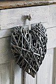 Heart shaped decoration hanging on handle
