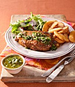 Grilled steaks with chimichurry sauce