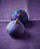 To blue figs on a purple linen cloth