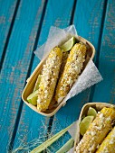 Grilled corn on the cob with limes