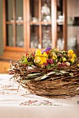 Easter table centre piece with spring flowers & willow twigs