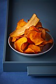 Various different vegetable crisps on a plate