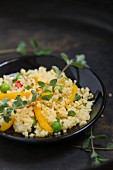 Fried millet with peppers and peas