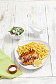 Grilled chicken breast with chips and salad