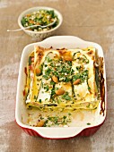 Courgette and ham lasagne with almonds and parsley
