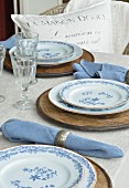 Table set in white and blue on veranda