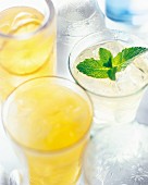 Summer cocktails made with lemon juice, ice cubes and mint