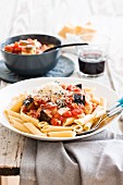 Penne rigate with a tomato and aubergine sauce and bacon