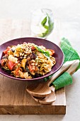 Noodles with grilled vegetables and pine nuts
