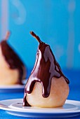 Poached pear with chocolate sauce
