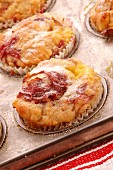 Rhubarb pudding cakes in a muffin tin