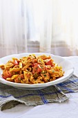 Penne with Chicken and Sundried Tomatoes in a White Bowl