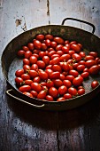 Date tomatoes in a rustic pan