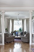 Elegant living room with grey sofa set in villa