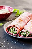 Beetroot crêpes filled with mozzarella and spinach