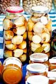 Jars of pickled English onions at a market